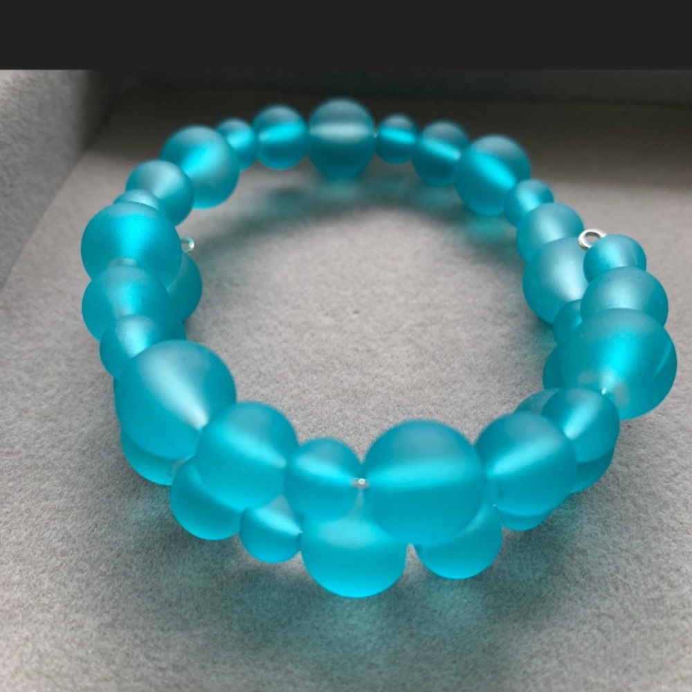 NWOT matte aqua blue beaded wire bracelet.